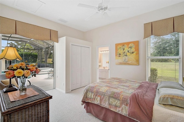 2111 Muskogee Trl, Nokomis, FL 34275 - bedroom featuring a closet, carpet, multiple windows, and access to exterior