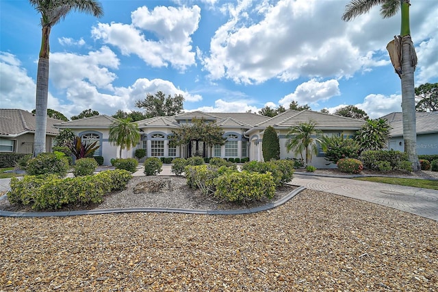 2111 Muskogee Trl, Nokomis, FL 34275 - mediterranean / spanish-style house with stucco siding and a tiled roof