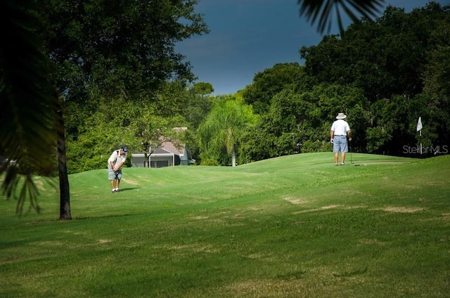 2111 Muskogee Trl, Nokomis, FL 34275 - view of community featuring golf course view and a yard