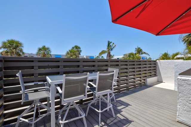 wooden deck featuring outdoor dining space