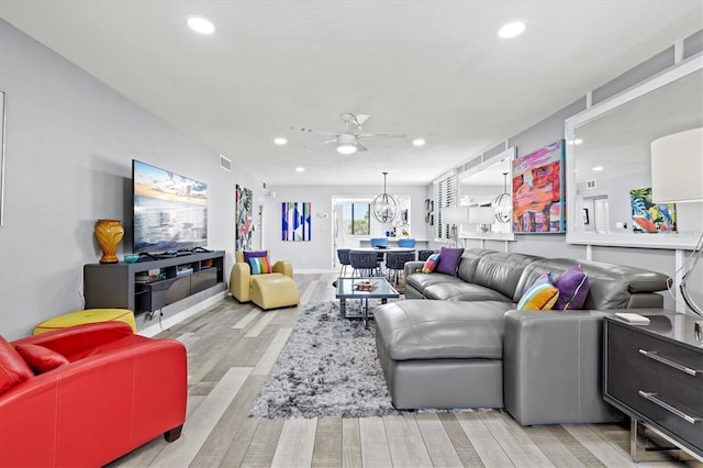 living room with ceiling fan, visible vents, light wood-style flooring, and recessed lighting