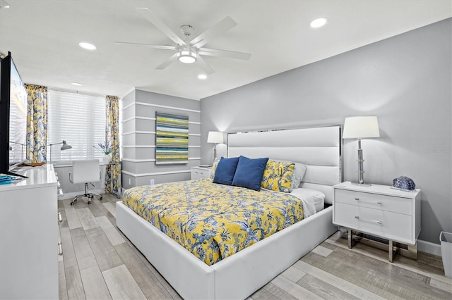 bedroom featuring wood finished floors, a ceiling fan, and recessed lighting