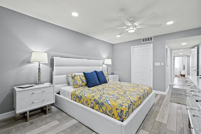 bedroom with baseboards, recessed lighting, and visible vents