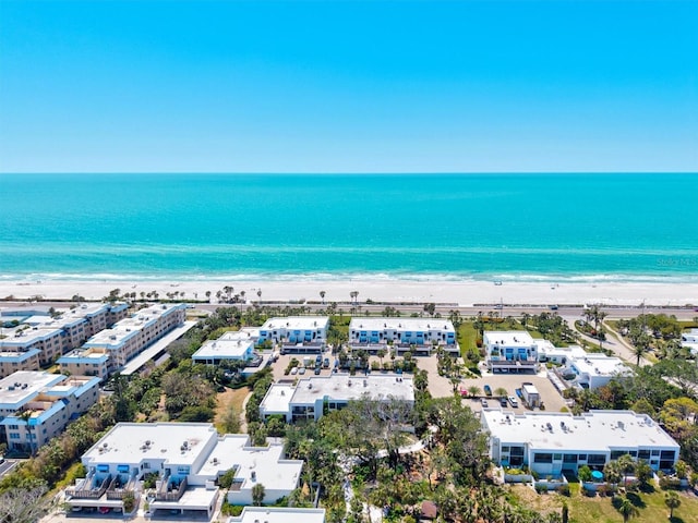 aerial view featuring a water view and a beach view
