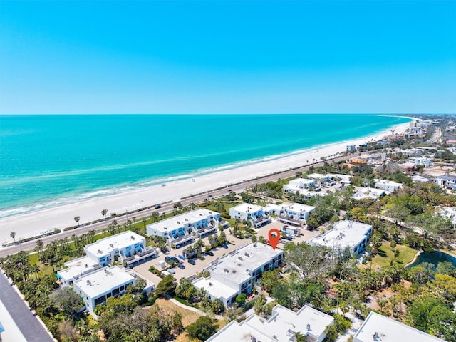 birds eye view of property featuring a view of the beach and a water view