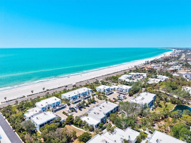birds eye view of property featuring a view of the beach and a water view