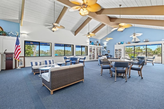 living area with beam ceiling, high vaulted ceiling, carpet flooring, a ceiling fan, and baseboards