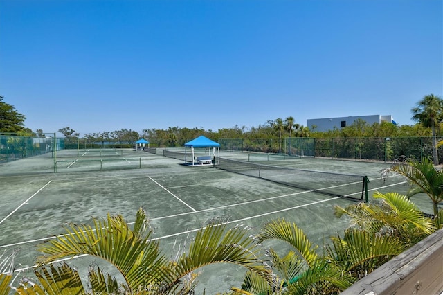 view of sport court featuring fence