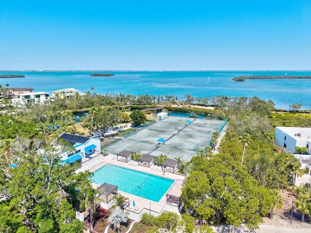 birds eye view of property with a water view