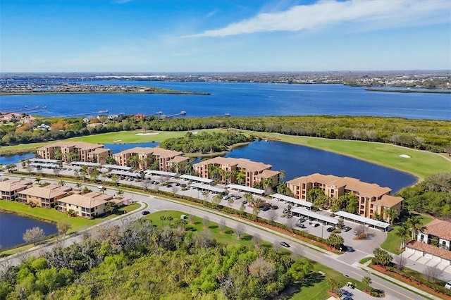 birds eye view of property featuring a water view and golf course view