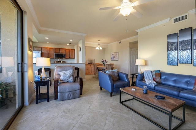 living area featuring ceiling fan, crown molding, visible vents, and light tile patterned flooring