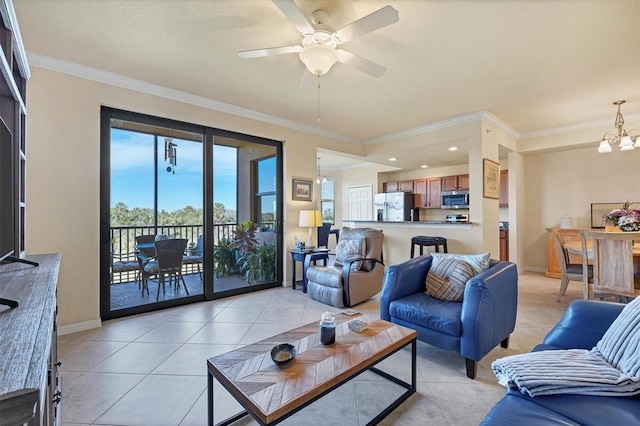 living room featuring light tile patterned floors, baseboards, crown molding, and ceiling fan with notable chandelier