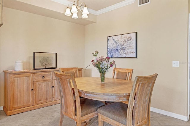 dining space with a chandelier, ornamental molding, baseboards, and visible vents