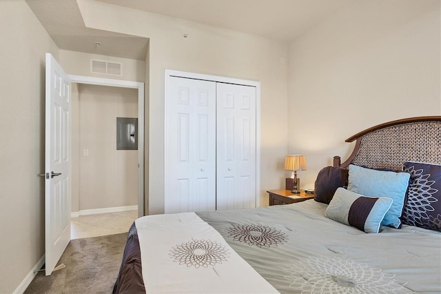 bedroom featuring baseboards, carpet floors, a closet, and visible vents