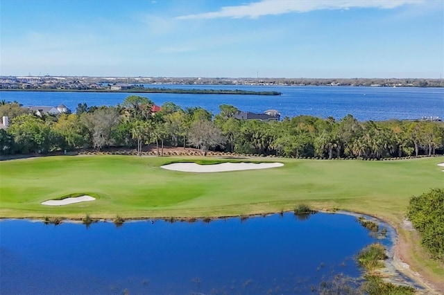 bird's eye view with a water view and golf course view