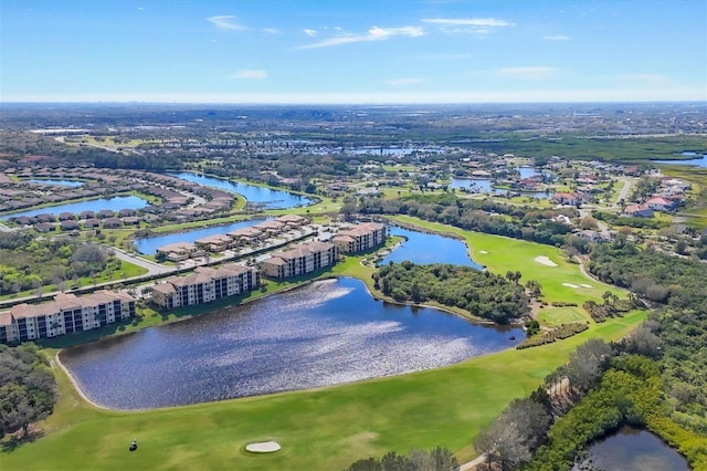 aerial view with a water view, a residential view, and view of golf course