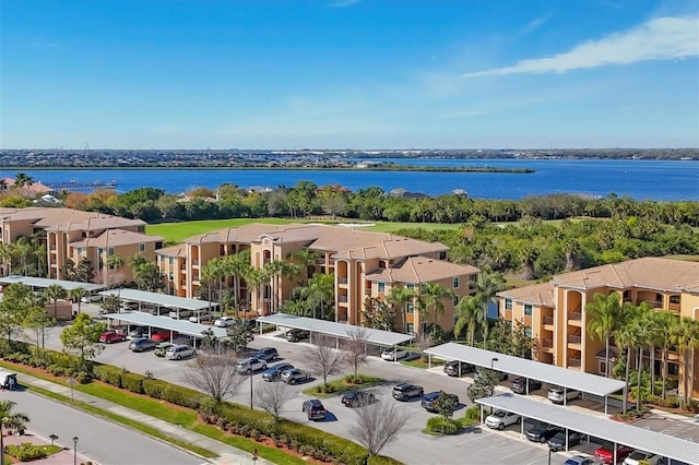 birds eye view of property featuring a water view