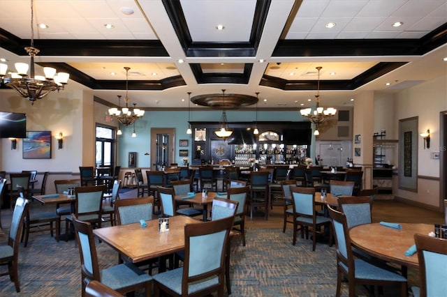 dining area featuring ornamental molding, carpet floors, a notable chandelier, and coffered ceiling