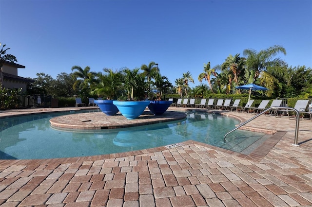 community pool with a patio area