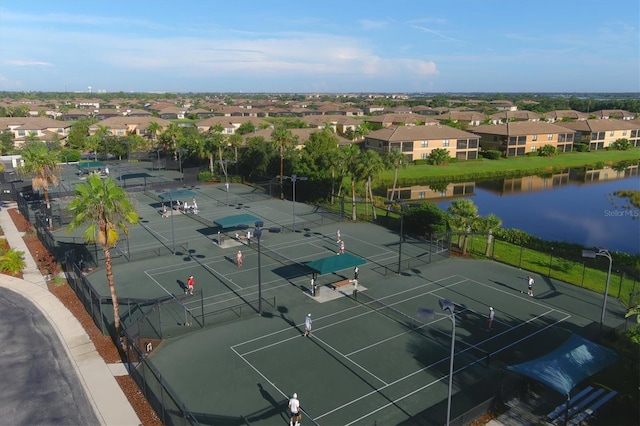 birds eye view of property featuring a water view and a residential view