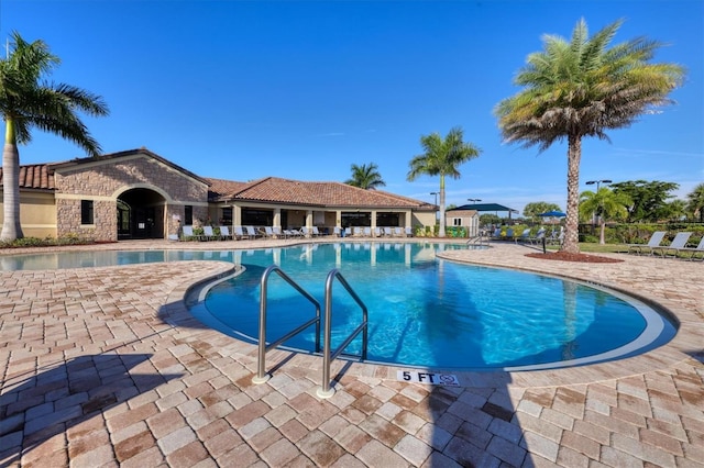 pool featuring a patio area