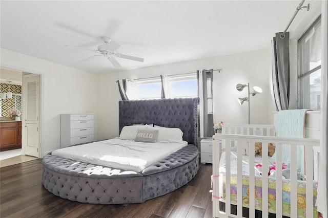 bedroom featuring ceiling fan and dark wood-style floors
