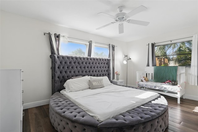 bedroom featuring baseboards, ceiling fan, and wood finished floors