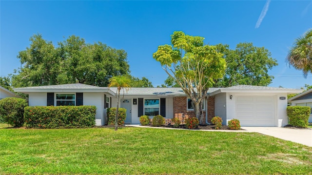 6529 Seagate Ave, Sarasota, FL 34231 - ranch-style home with a garage, a front lawn, and driveway