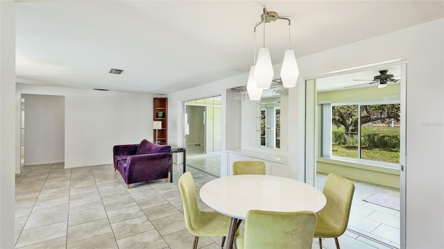 6529 Seagate Ave, Sarasota, FL 34231 - dining area featuring light tile patterned flooring