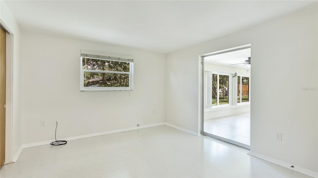 6529 Seagate Ave, Sarasota, FL 34231 - empty room featuring baseboards and concrete flooring