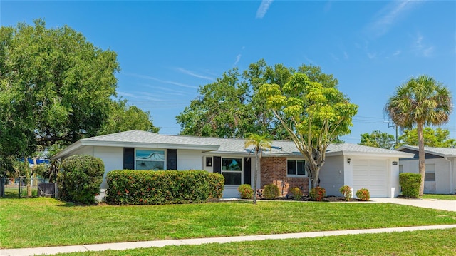 6529 Seagate Ave, Sarasota, FL 34231 - ranch-style home with an attached garage, a front yard, and driveway