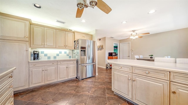 3761 Countryside Rd, Sarasota, FL 34233 - kitchen featuring visible vents, decorative backsplash, ceiling fan, light countertops, and stainless steel fridge with ice dispenser