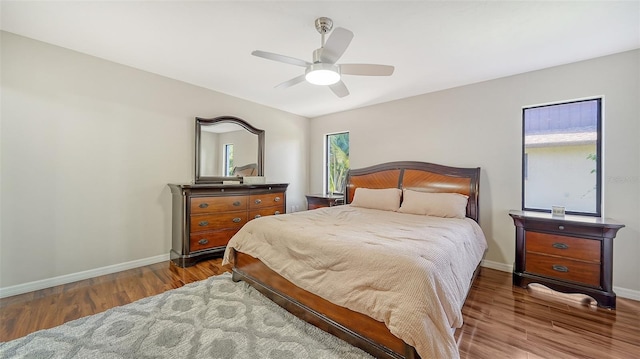 3761 Countryside Rd, Sarasota, FL 34233 - bedroom with baseboards, ceiling fan, and wood finished floors