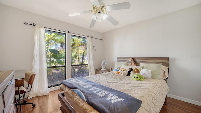 3761 Countryside Rd, Sarasota, FL 34233 - bedroom with baseboards, ceiling fan, and wood finished floors