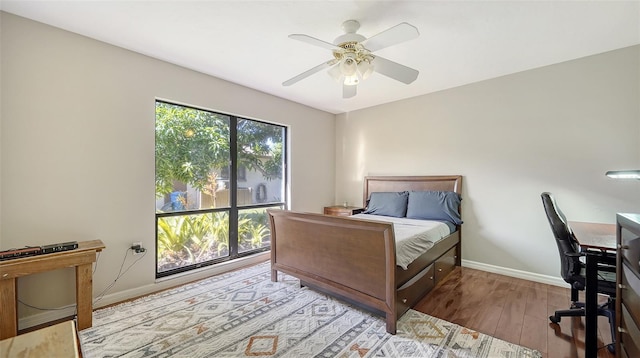 3761 Countryside Rd, Sarasota, FL 34233 - bedroom with baseboards, a ceiling fan, and wood finished floors