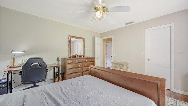 3761 Countryside Rd, Sarasota, FL 34233 - bedroom with ceiling fan, visible vents, and wood finished floors