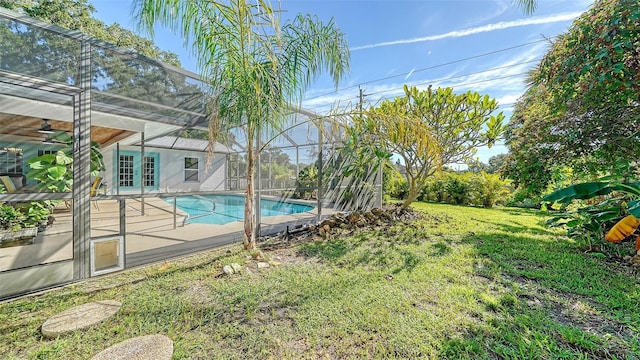 3761 Countryside Rd, Sarasota, FL 34233 - outdoor pool with glass enclosure, a yard, and a patio area