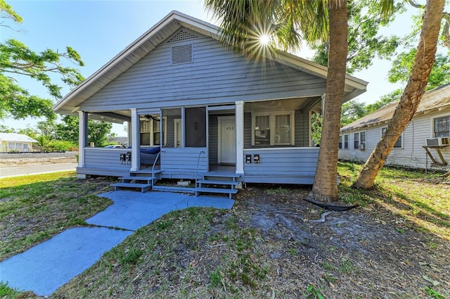432 Adelia Ave, Sarasota, FL 34236 - bungalow-style house with cooling unit and a sunroom