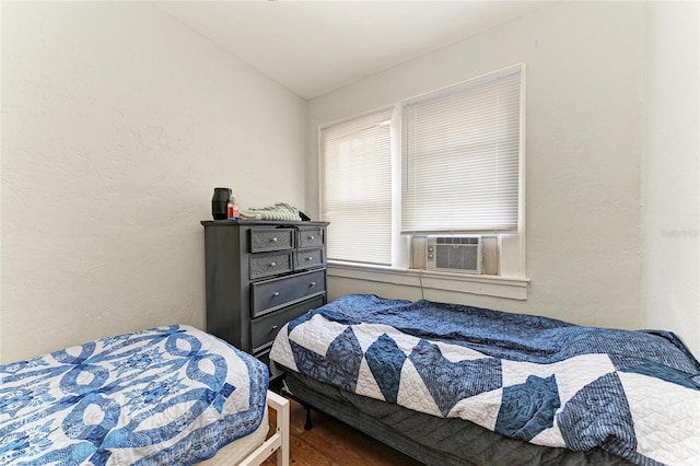 432 Adelia Ave, Sarasota, FL 34236 - bedroom with a textured wall, lofted ceiling, wood finished floors, and cooling unit