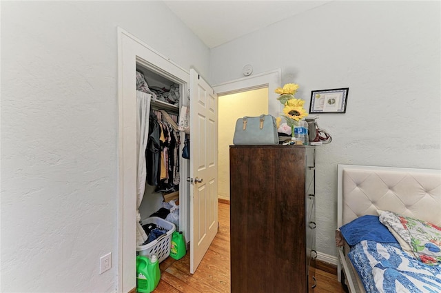 432 Adelia Ave, Sarasota, FL 34236 - bedroom with baseboards, wood finished floors, and a closet