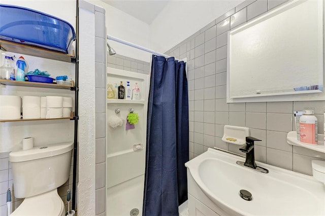 432 Adelia Ave, Sarasota, FL 34236 - bathroom featuring toilet, tile walls, a sink, and a stall shower