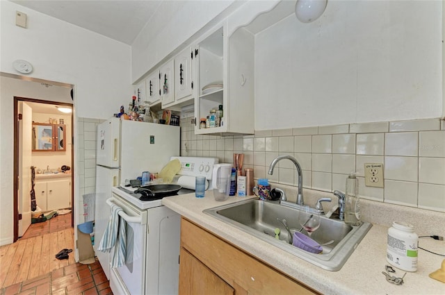432 Adelia Ave, Sarasota, FL 34236 - kitchen featuring a sink, backsplash, white appliances, and light countertops