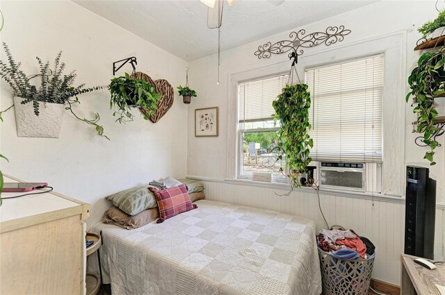 432 Adelia Ave, Sarasota, FL 34236 - bedroom featuring a wainscoted wall and cooling unit