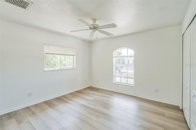 interior space featuring visible vents, plenty of natural light, and light wood-type flooring
