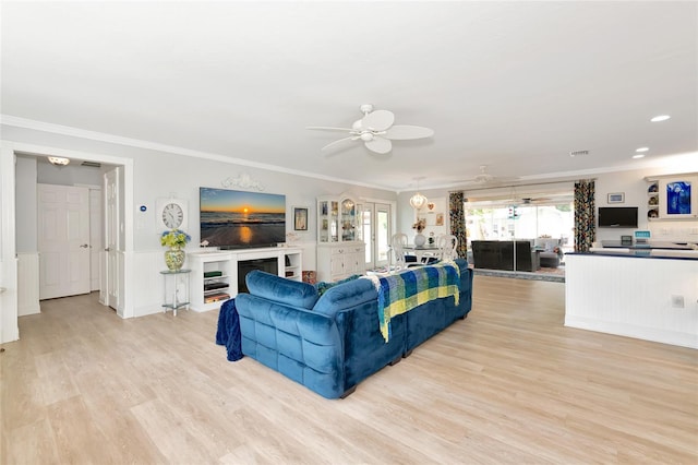 1722 Hazelwood St, Sarasota, FL 34231 - living area with light wood-type flooring, ceiling fan, crown molding, wainscoting, and recessed lighting