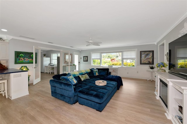 1722 Hazelwood St, Sarasota, FL 34231 - living room featuring baseboards, light wood-type flooring, ceiling fan, and ornamental molding