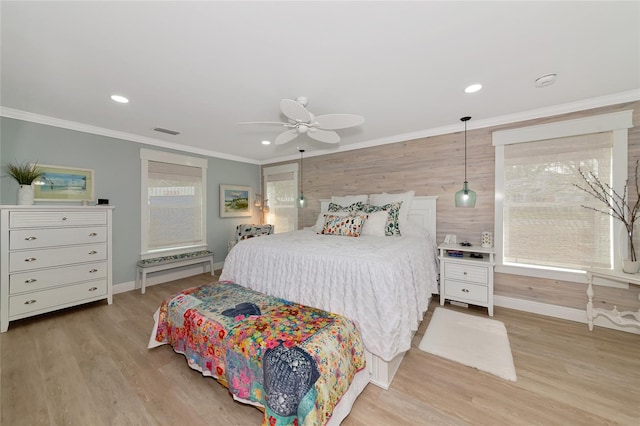 1722 Hazelwood St, Sarasota, FL 34231 - bedroom with baseboards, light wood-type flooring, crown molding, wooden walls, and multiple windows