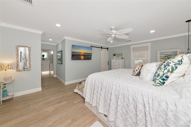 1722 Hazelwood St, Sarasota, FL 34231 - bedroom with baseboards, recessed lighting, wood finished floors, crown molding, and a barn door