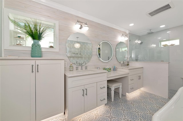 1722 Hazelwood St, Sarasota, FL 34231 - bathroom with a walk in shower, double vanity, plenty of natural light, and recessed lighting