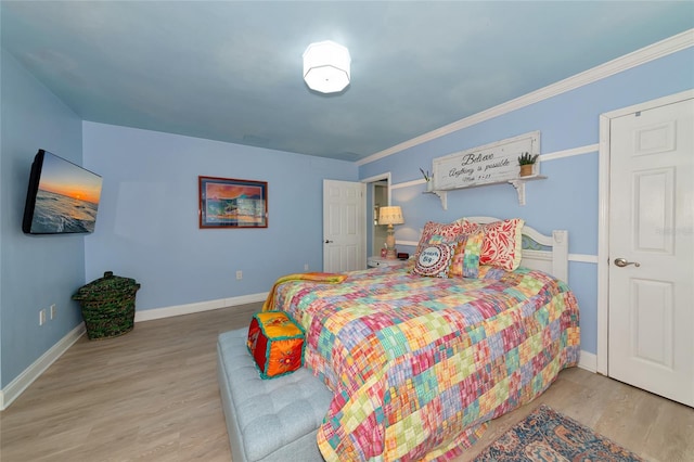 1722 Hazelwood St, Sarasota, FL 34231 - bedroom with wood finished floors, baseboards, and crown molding